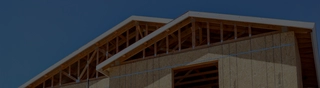 Image of partially rebuilt wood frame structure